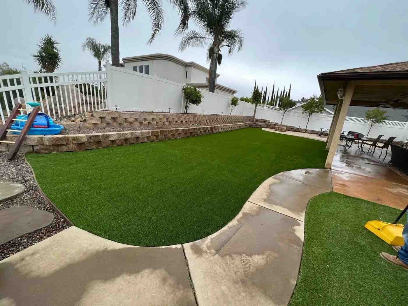 Dog relaxing on artificial turf